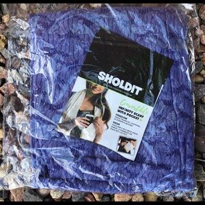 Blue Sholdit convertible infinity scarf with pocket.